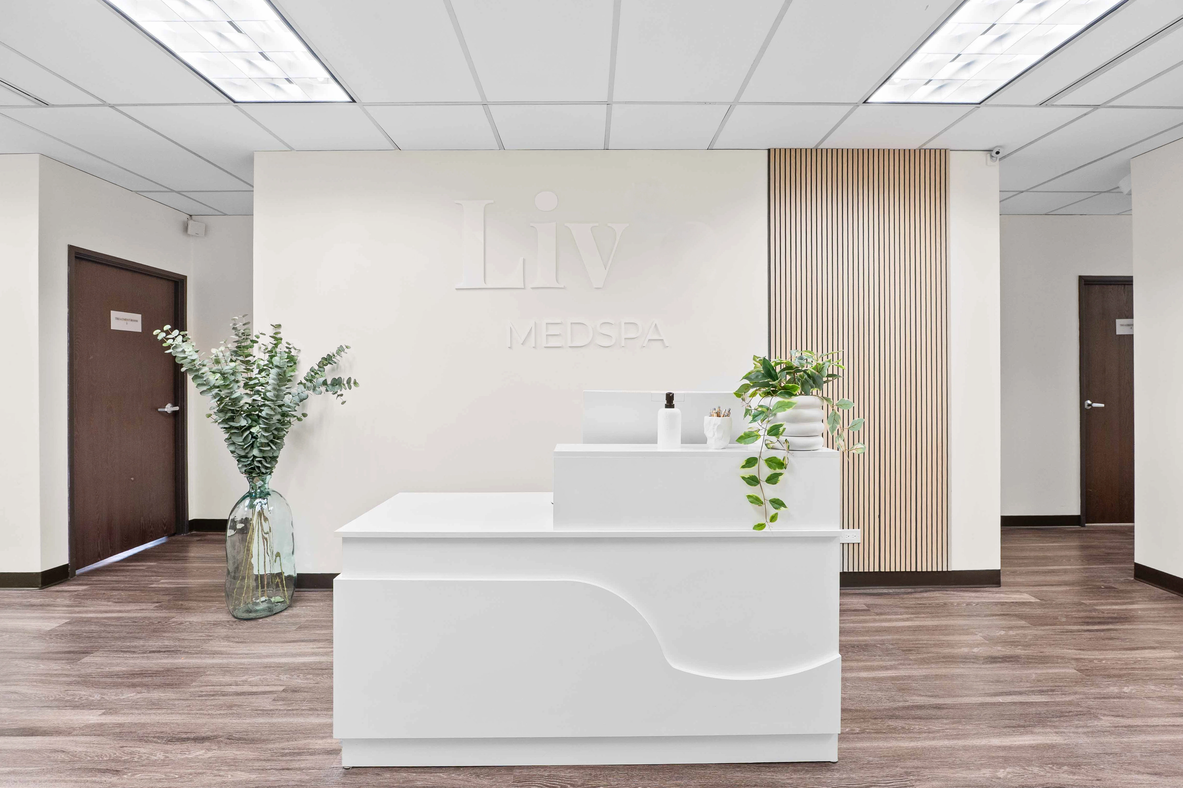 Spacious reception with eucalyptus arrangement