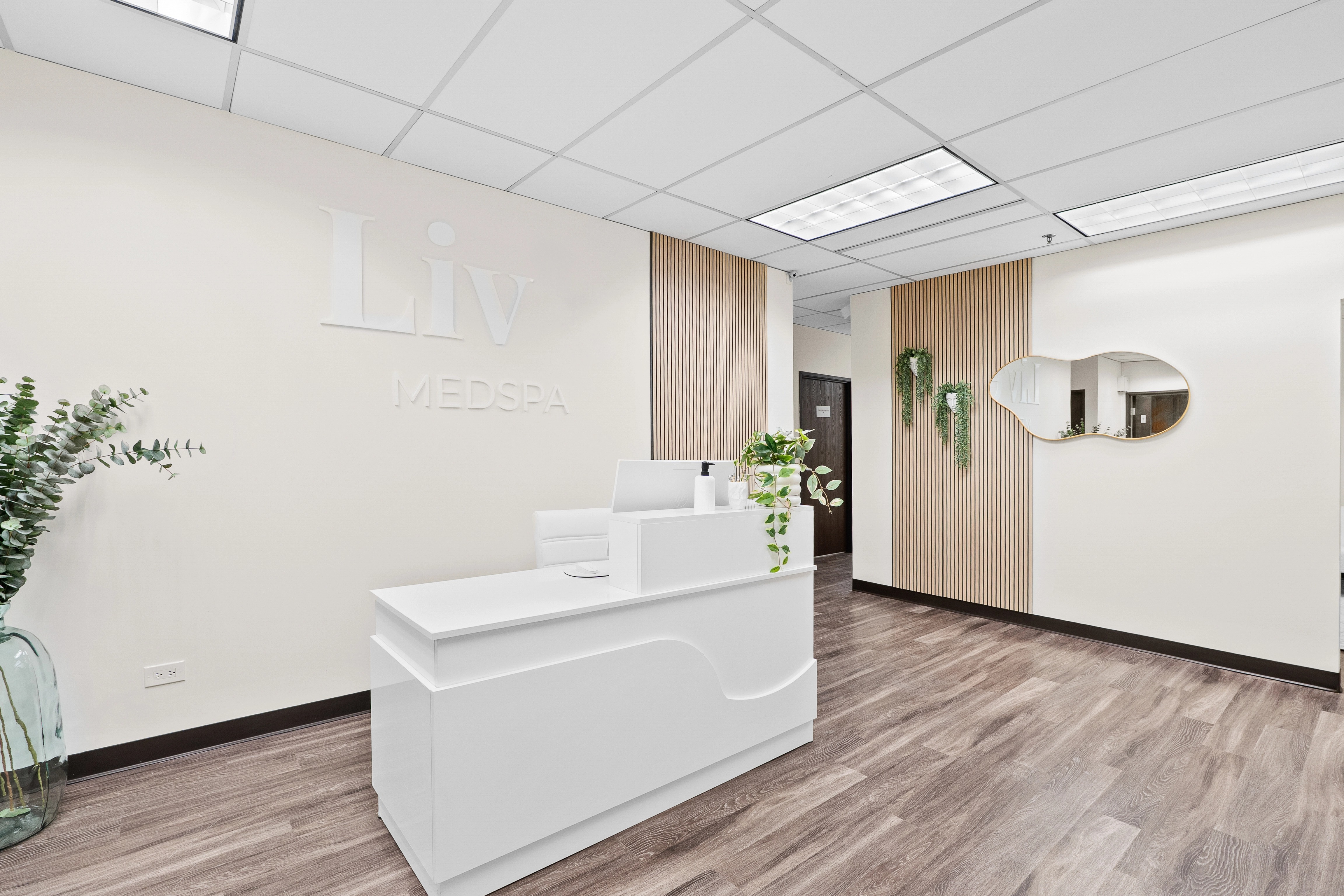 Liv Medspa reception area with wood accents