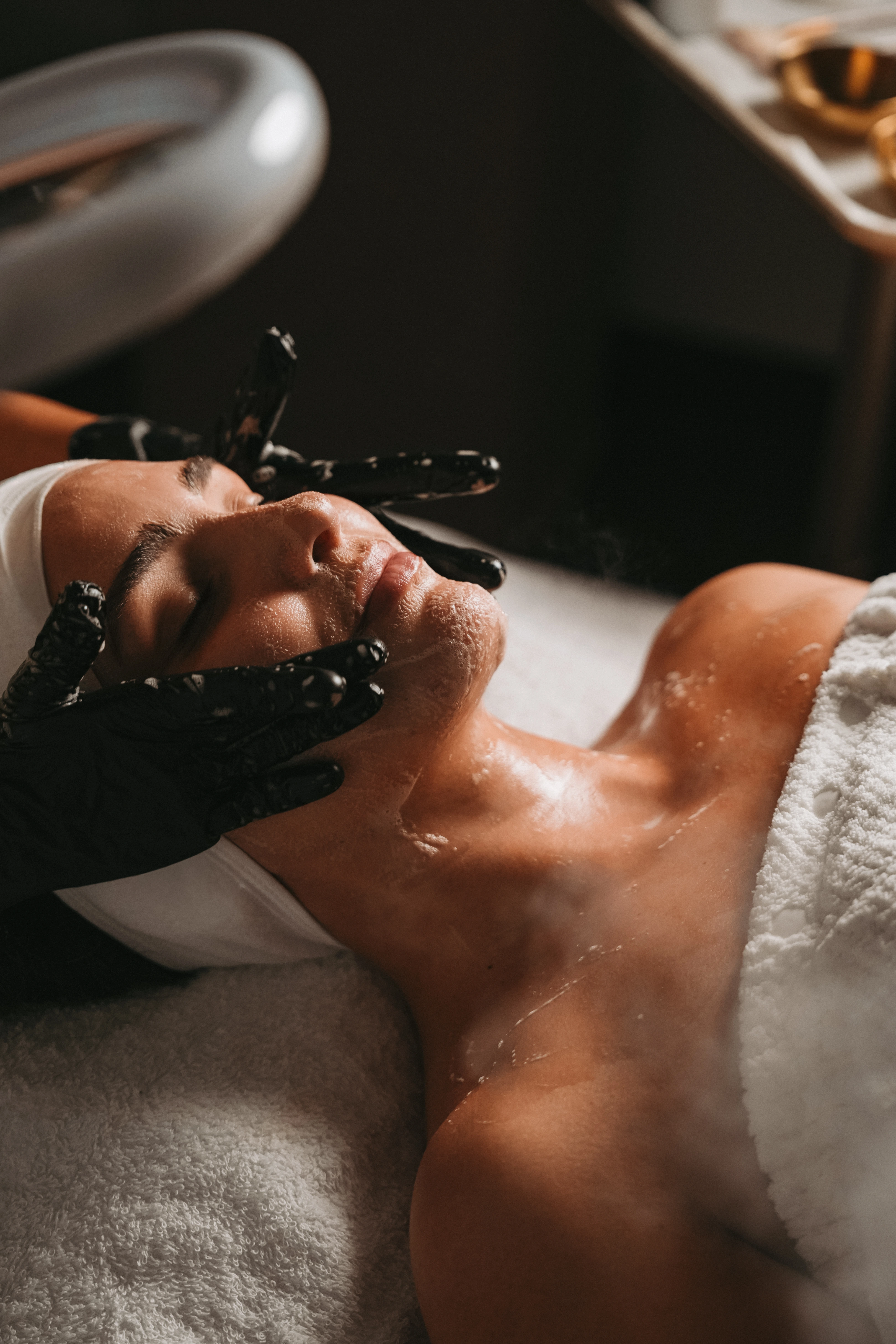 Facial massage with gold bowls